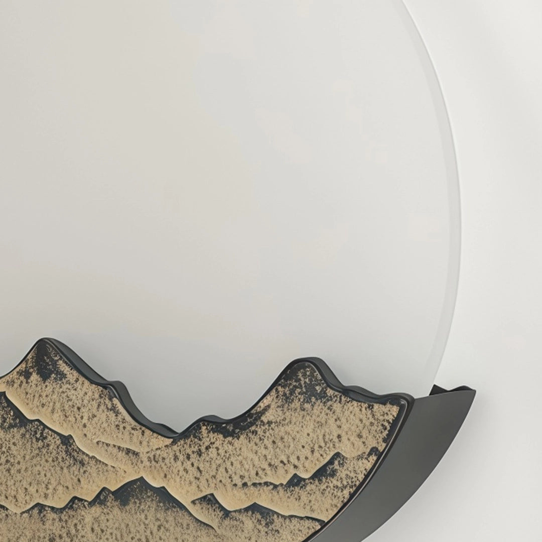 Side view of a round outdoor sconce with a white circular shade and mountain base.