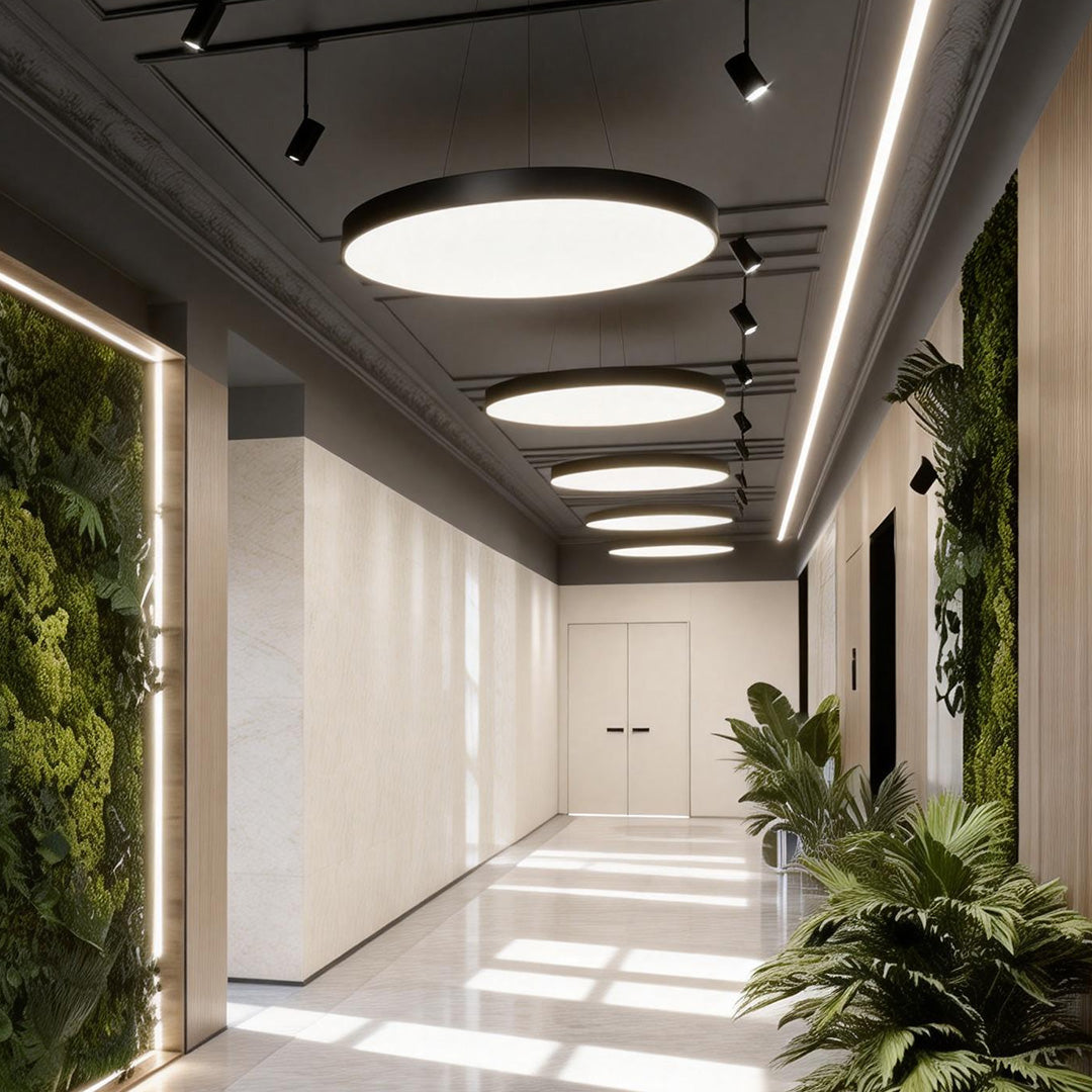 Bright office corridor with linear layout enhanced by evenly spaced round pendant lights.