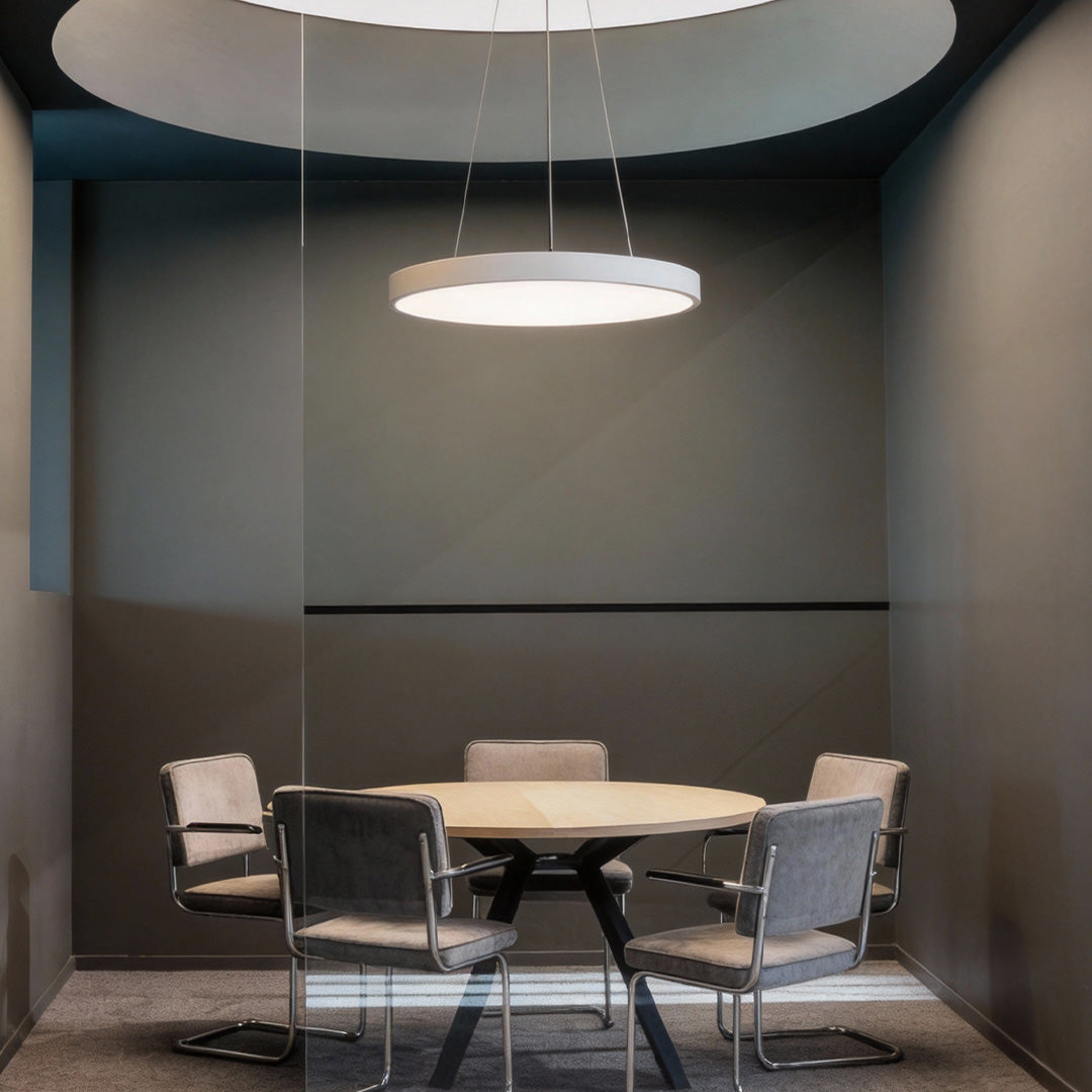 Private meeting space styled with soft-glow round pendant lights creating a calm atmosphere.