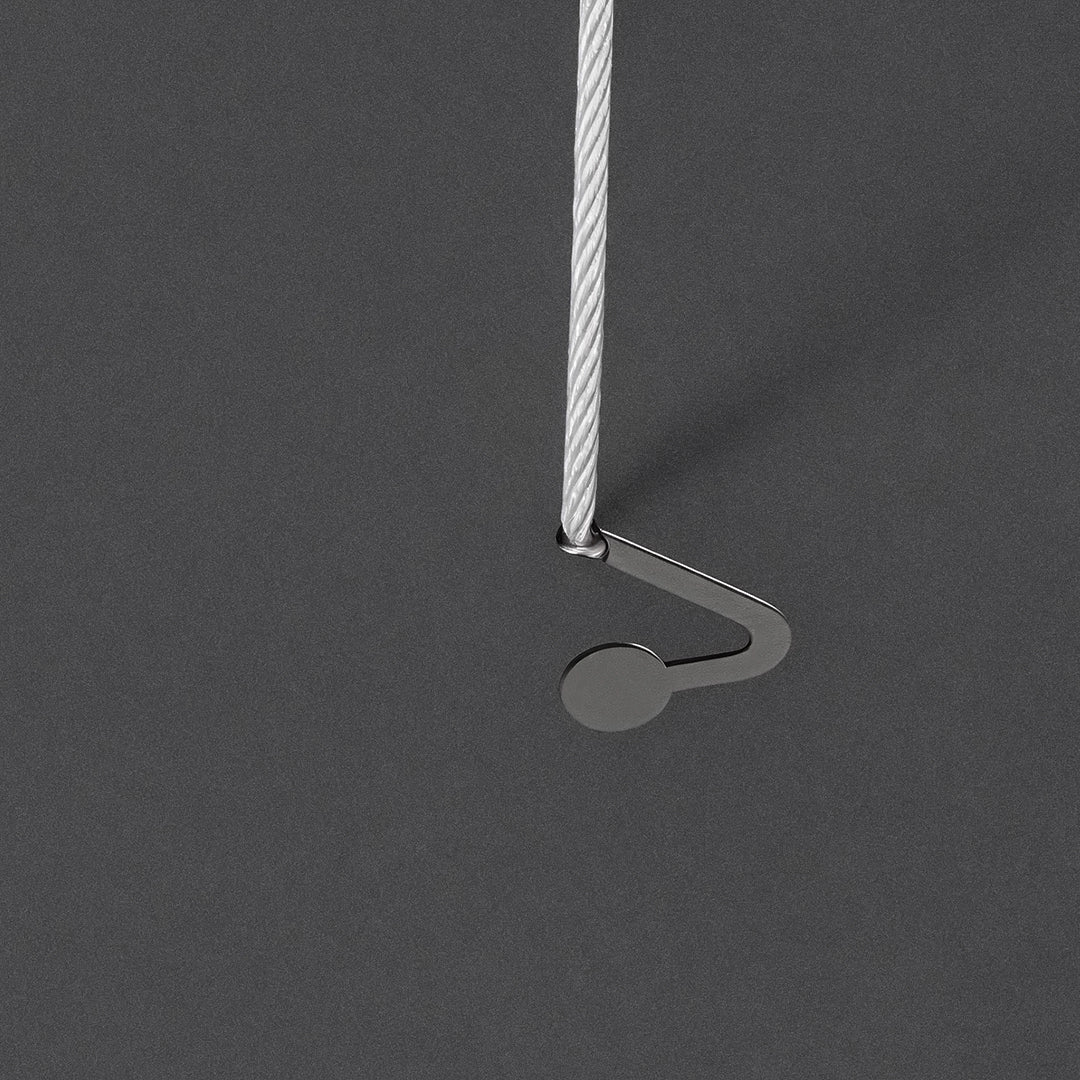 Close-up of the suspension wire and support hook for round pendant lights.