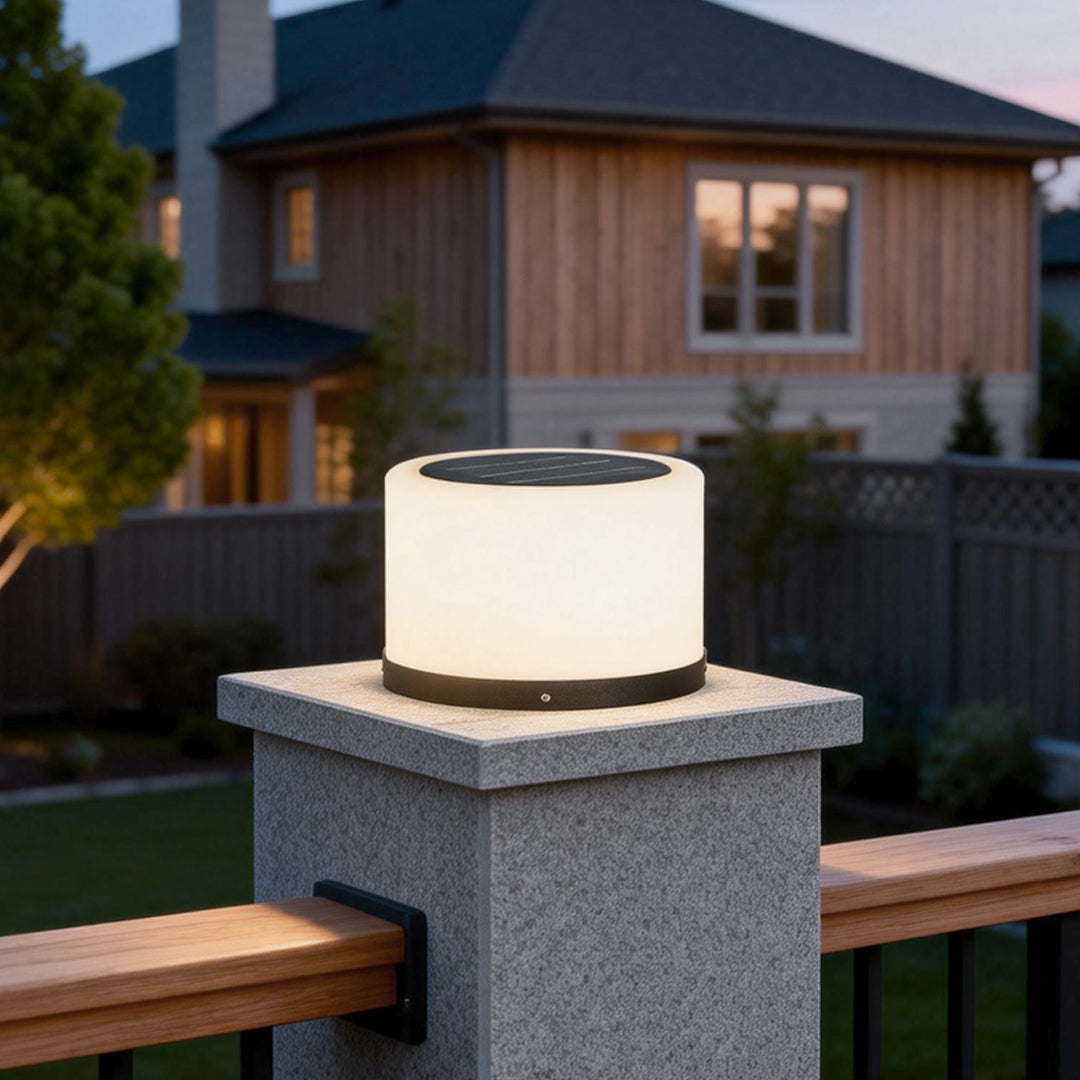 Round pillar lights enhancing a garden pathway with a warm glow.