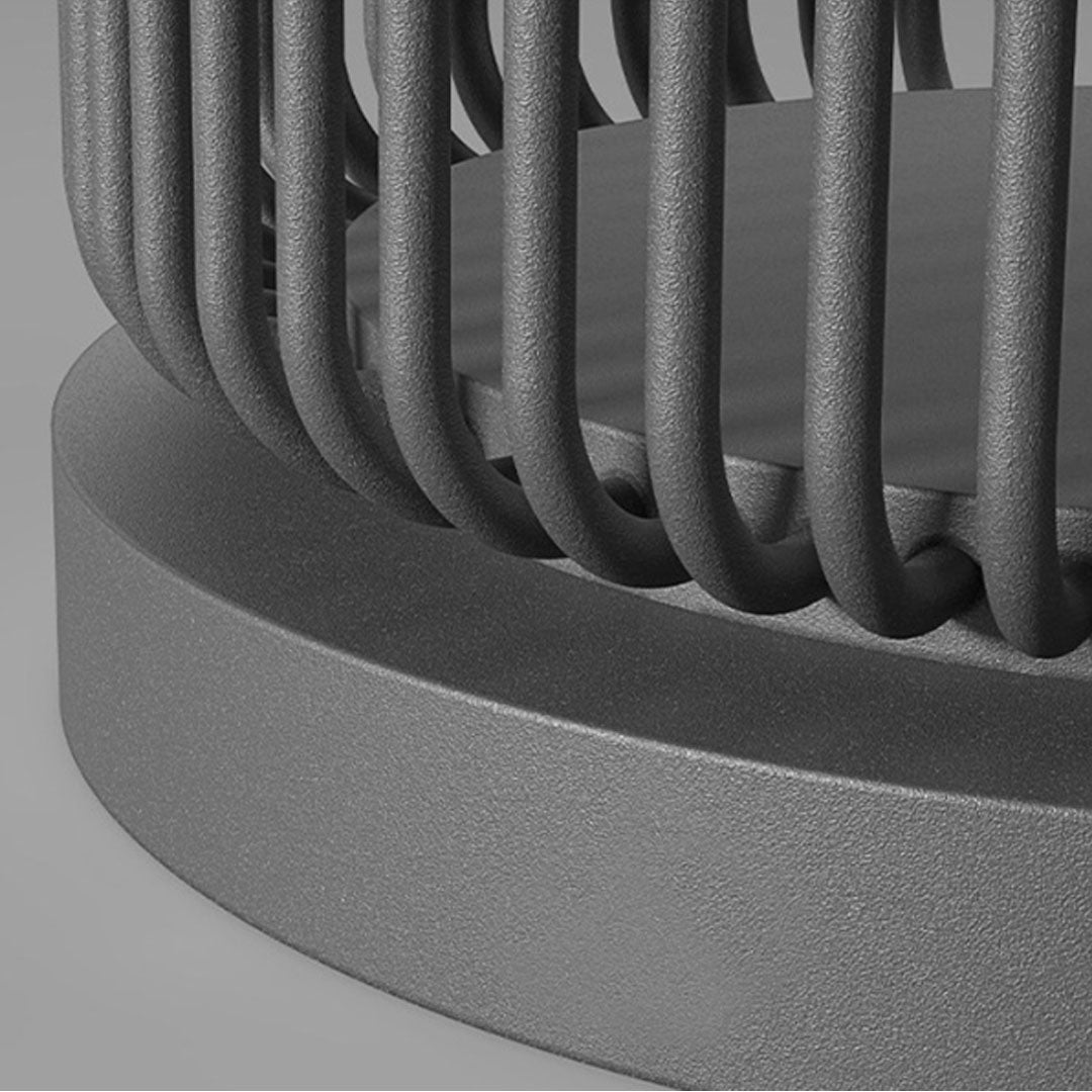 Close-up detail of round pillar lights outdoor showing textured metal frame and modern finish.