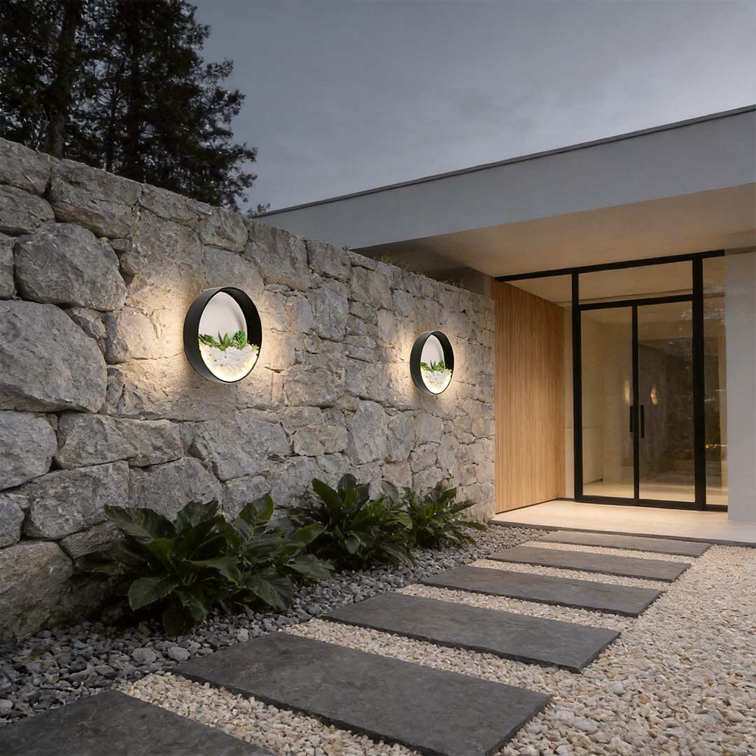 Round plant wall lamp providing soft illumination for a stylish garden wall.