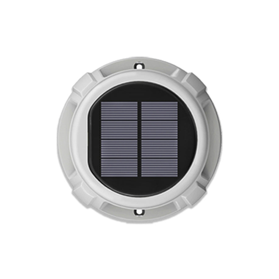 Single round solar ground light with silver housing and black solar panel on white background