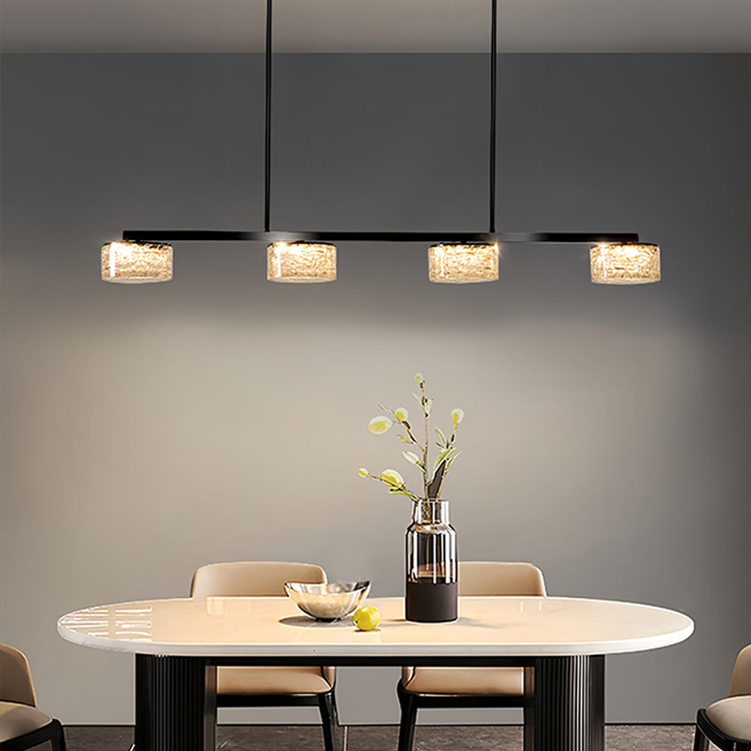 Modern LED linear pendant light suspended over round dining table in contemporary gray interior