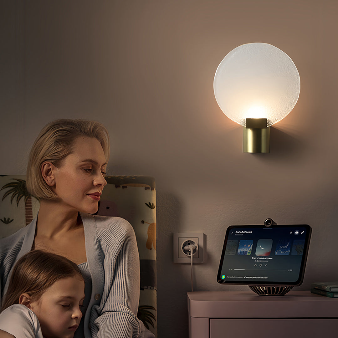 Family scene with a round wall light featuring a frosted glass shade, adding warmth to a bedroom workspace.