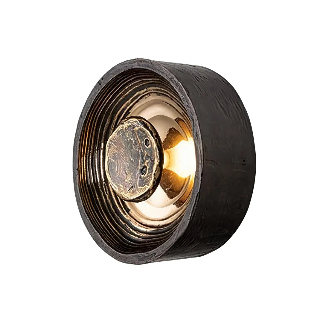 Round wall sconce single product view with a layered circular frame and warm accent lighting.