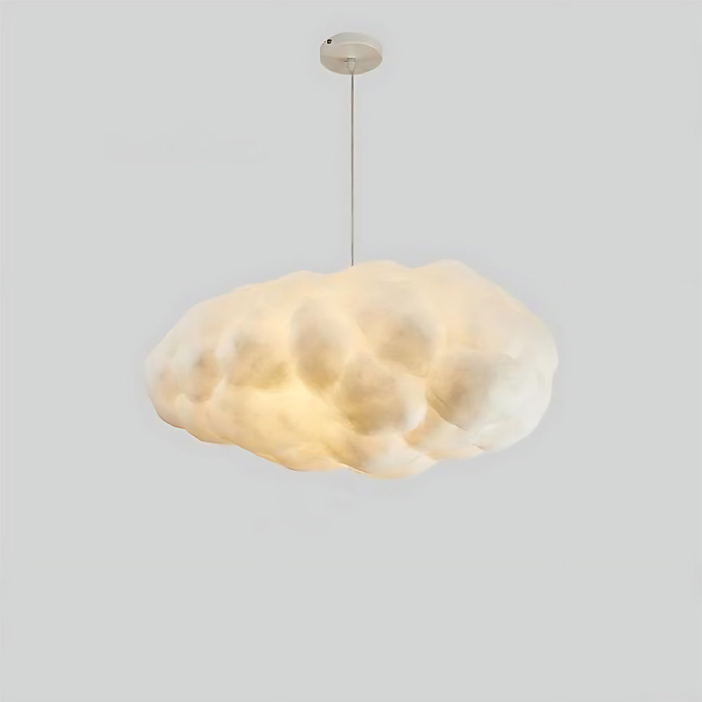 Rounded cloud pendant light displayed with soft warm illumination.