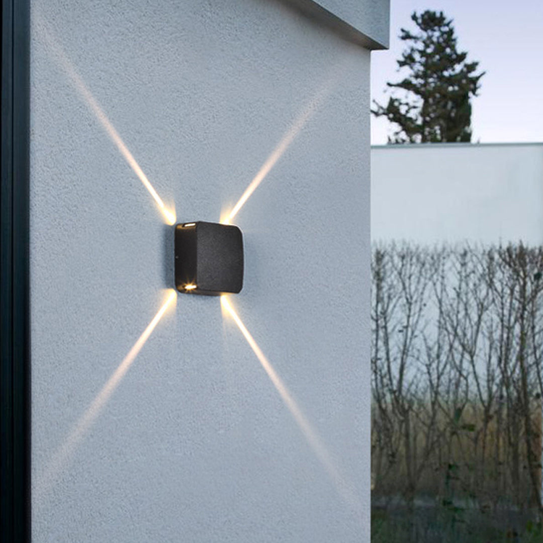 Contemporary black wall light with rounded square profile and sophisticated modern styling