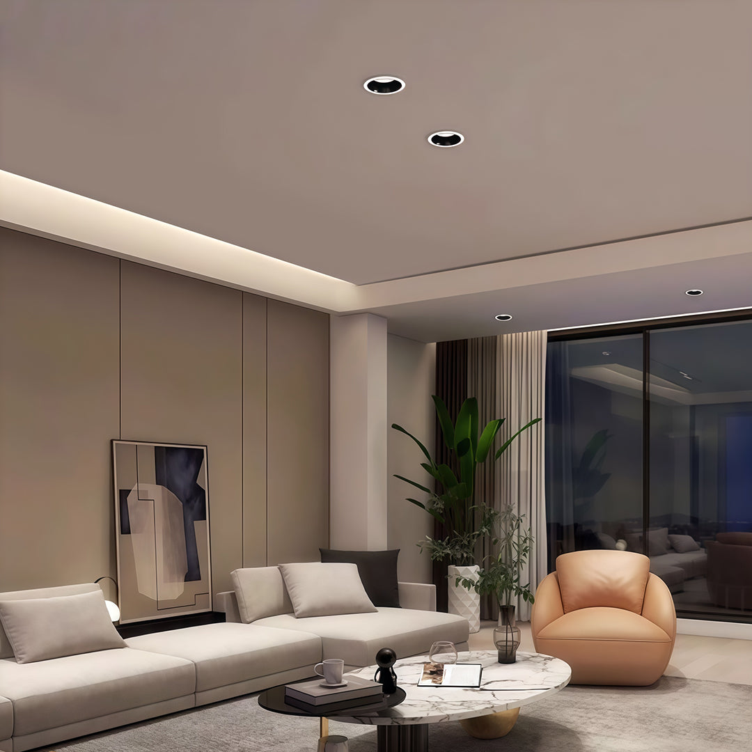 Row of recessed spotlights creating dramatic lighting in elegant living space with linear track accent