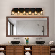 Black vanity bathroom light with three bulbs, adding a modern touch to a rustic bathroom decor.
