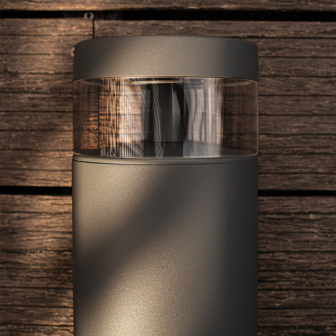 Pathway lights outdoor creating dramatic illumination against rustic brick wall with warm ambient lighting effect