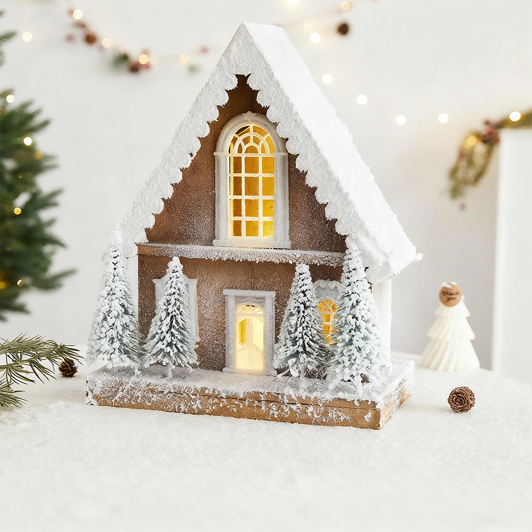 Rustic chalet with a snowy roof and trees, adding charm to light up wooden christmas houses collections.