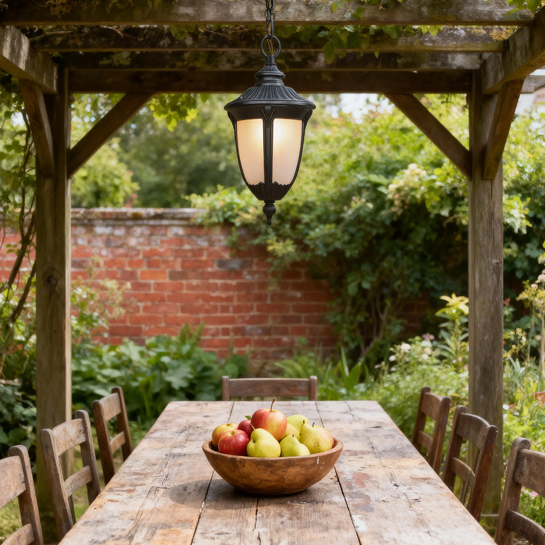 Outdoor porch pendant light above a rustic dining table, stylish and warm exterior lighting