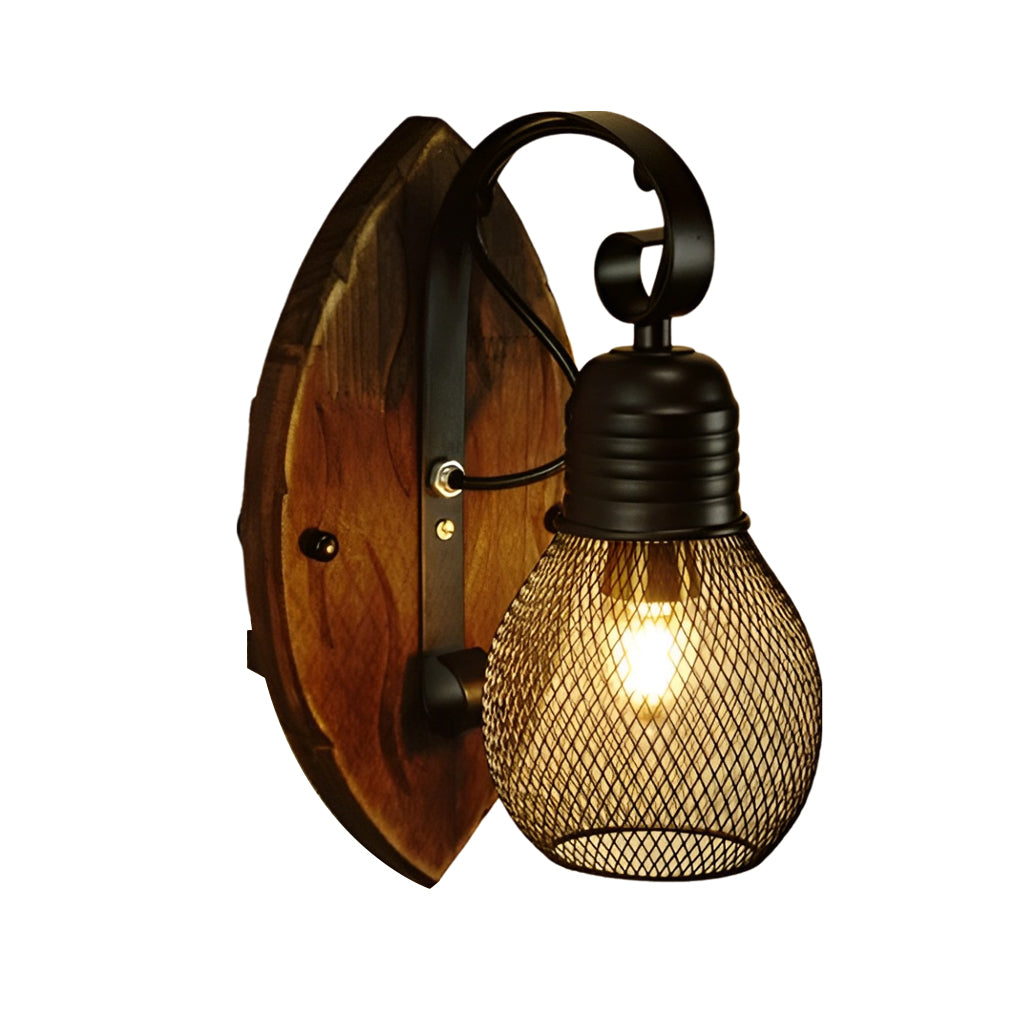 Rustic farmhouse wall sconce with a round wood backplate and black mesh shade on a white background.