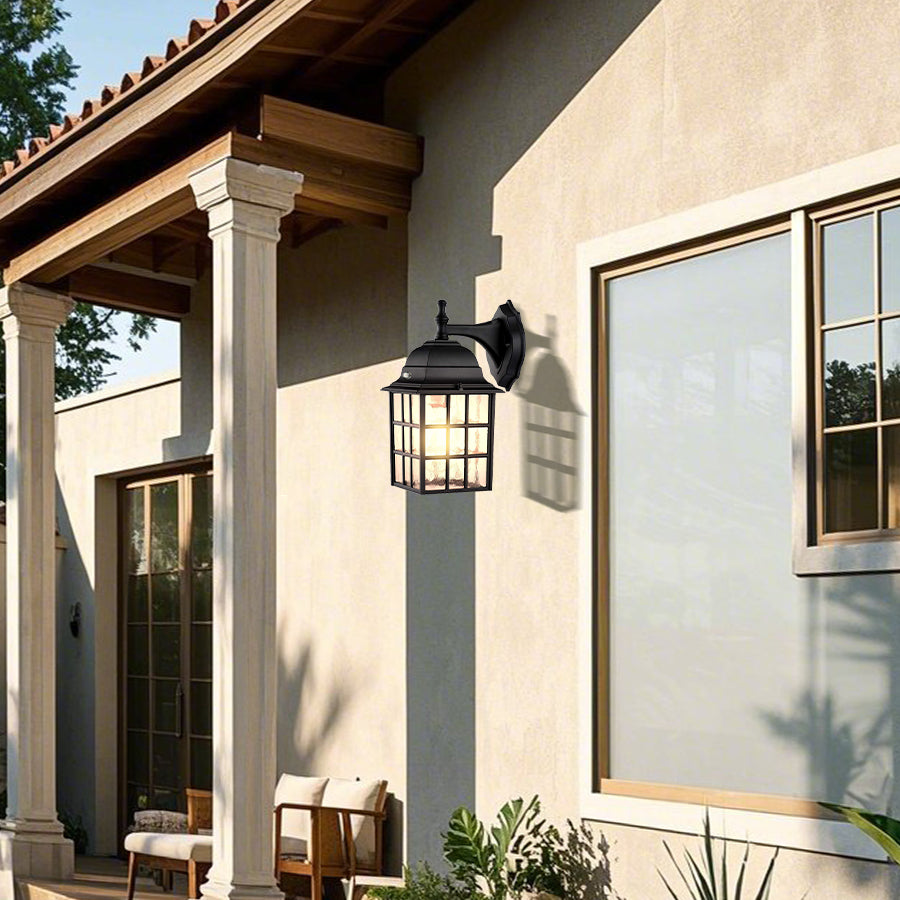 Rustic outdoor wall lighting installation on Mediterranean-style home with natural stone and stucco exterior