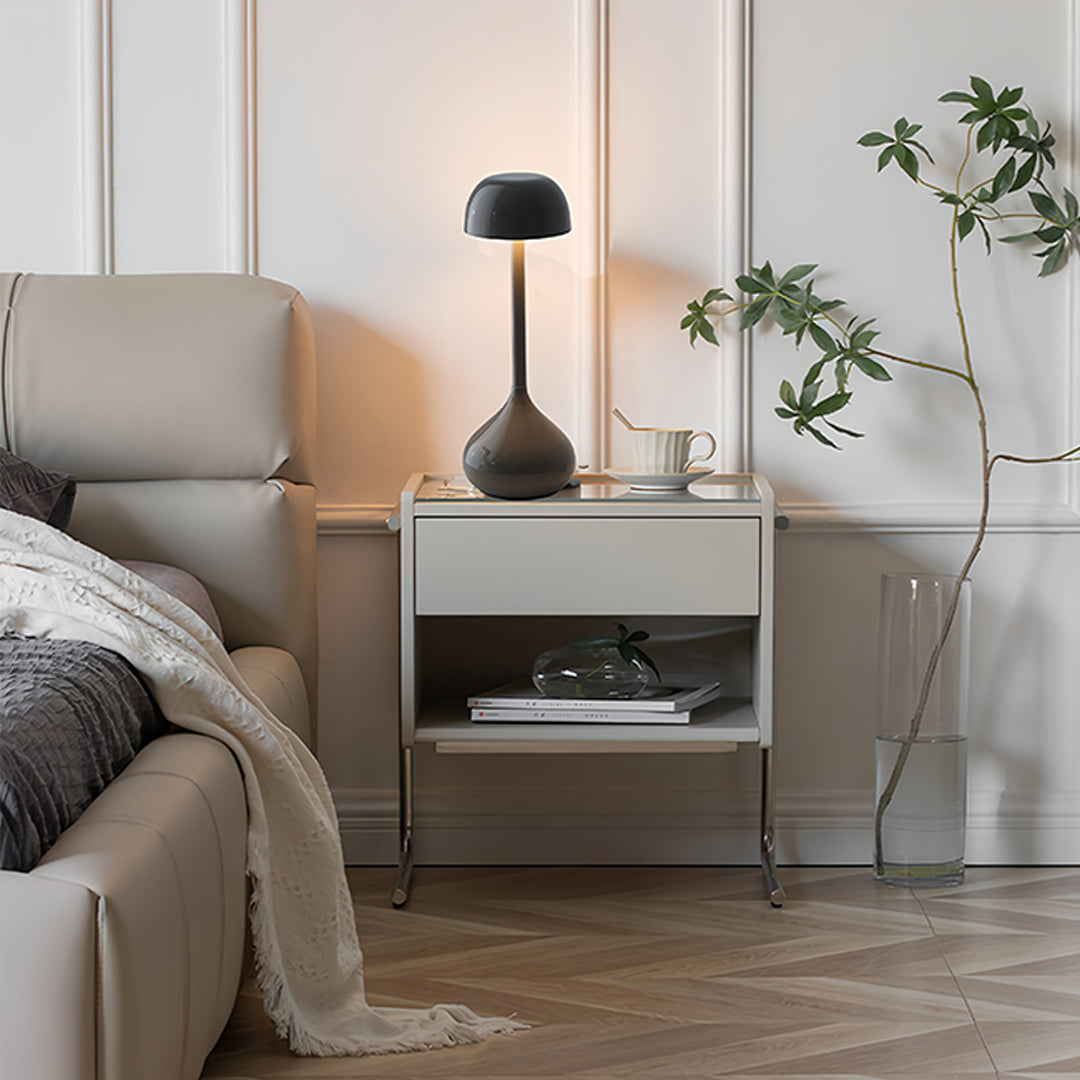 Rustic metal table lamps positioned on bedroom nightstand creating intimate lighting
