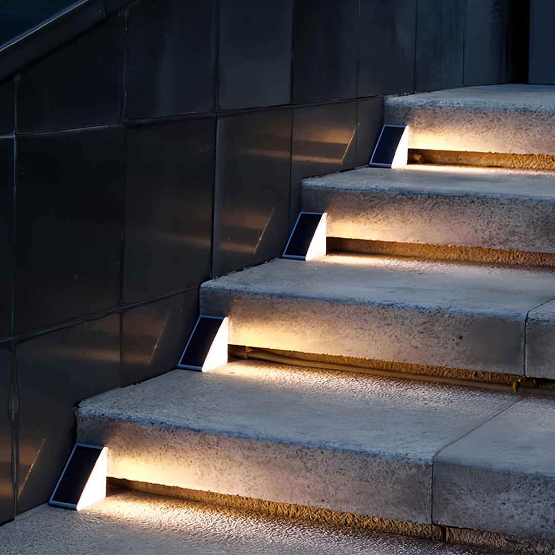 Rustic outdoor solar step lights enhancing wooden staircase with automatic dusk-to-dawn operation