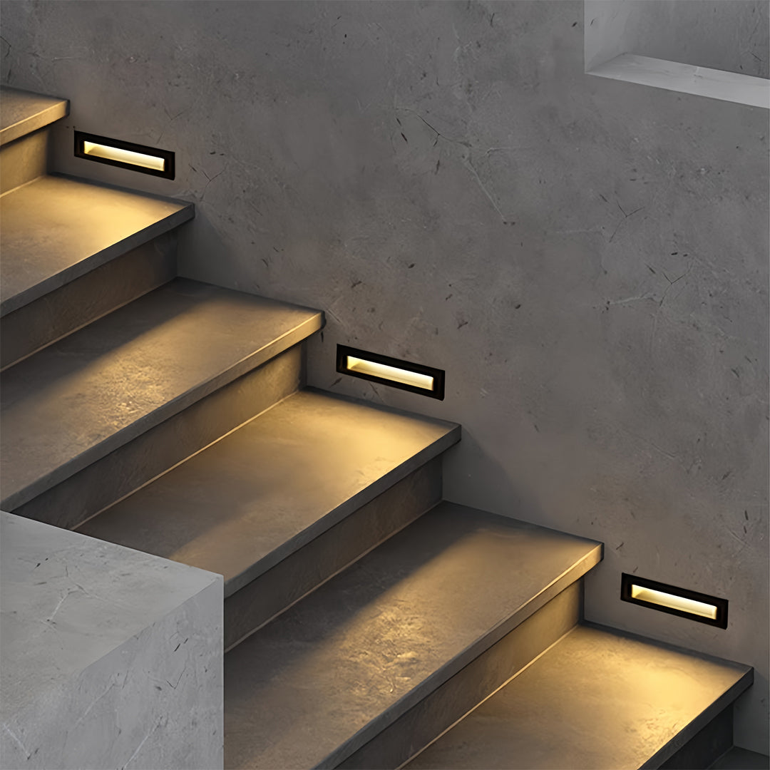 Deck lights for steps creating step safety lighting on contemporary residential concrete stairs