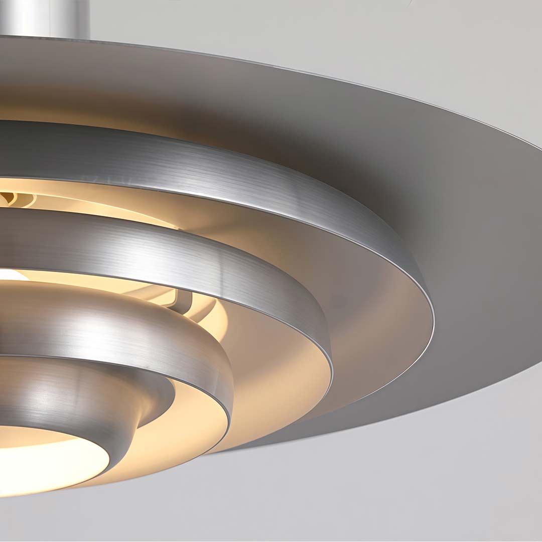 Saucer pendant light enhancing a contemporary dining area with soft light.