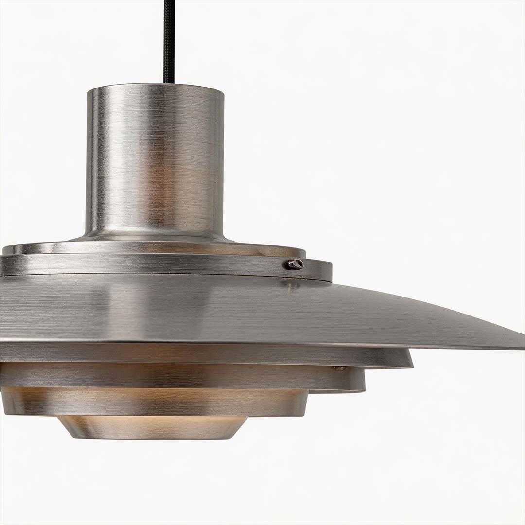 Saucer pendant light illuminating a stylish kitchen with elegant glow.