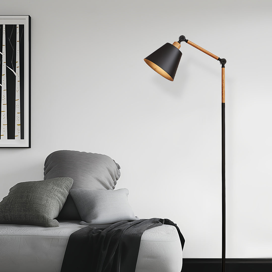 Scandinavian metallic floor lamp with white shade and natural wood accents in cozy bedroom environment