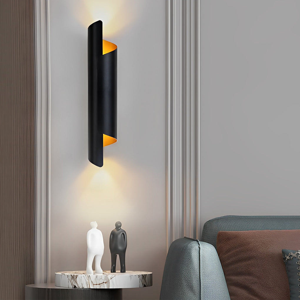 Scroll wall sconce with black and gold finish, adding a touch of sophistication to a modern living room.