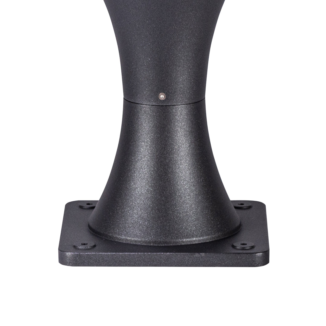 Dark sculptural bollard light fixture with flared top design for architectural outdoor illumination