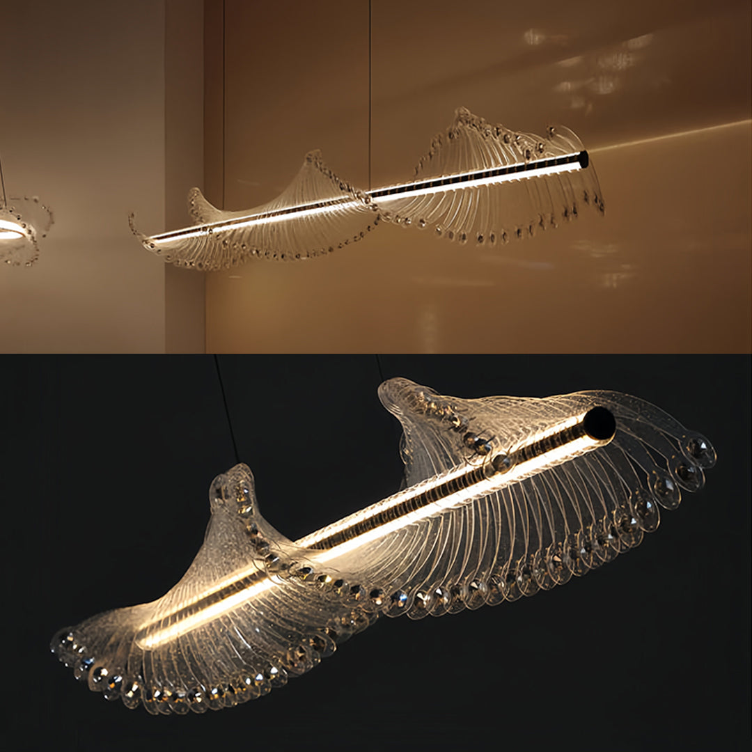 Luxurious spiral chandelier installed over dining table with sculptural fish-like form and brilliant crystal illumination