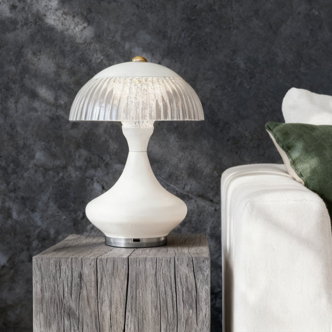 Sculptural white table unique lamps on a raw wood block side table, adding a focal point to the living room.