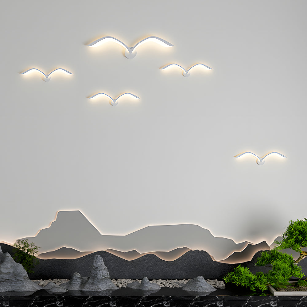 Seagull lighting sconces with a close-up of their minimalist seagull-inspired shape.