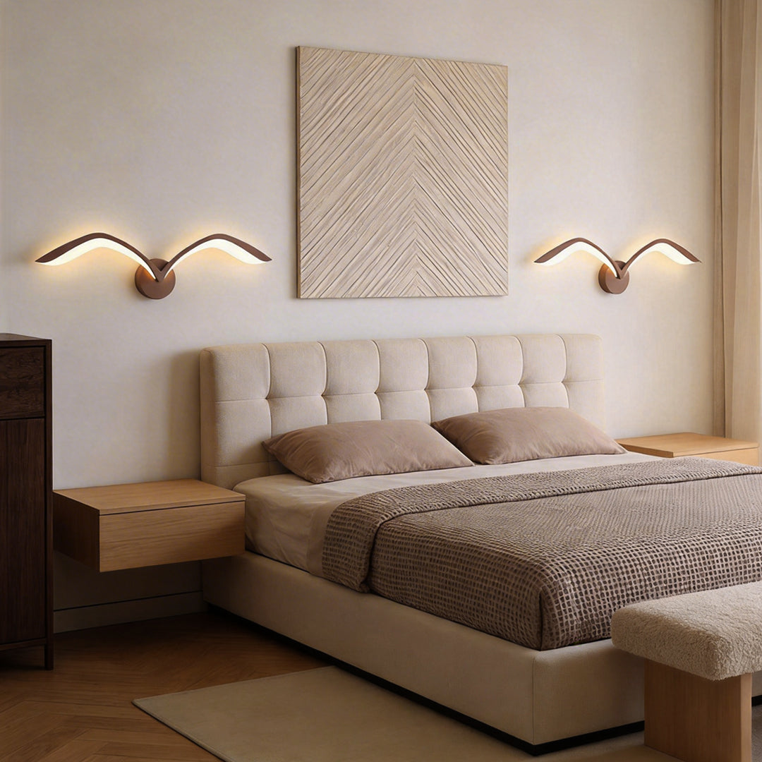 Seagull lighting sconces with a modern design, providing elegant illumination in a cozy bedroom.