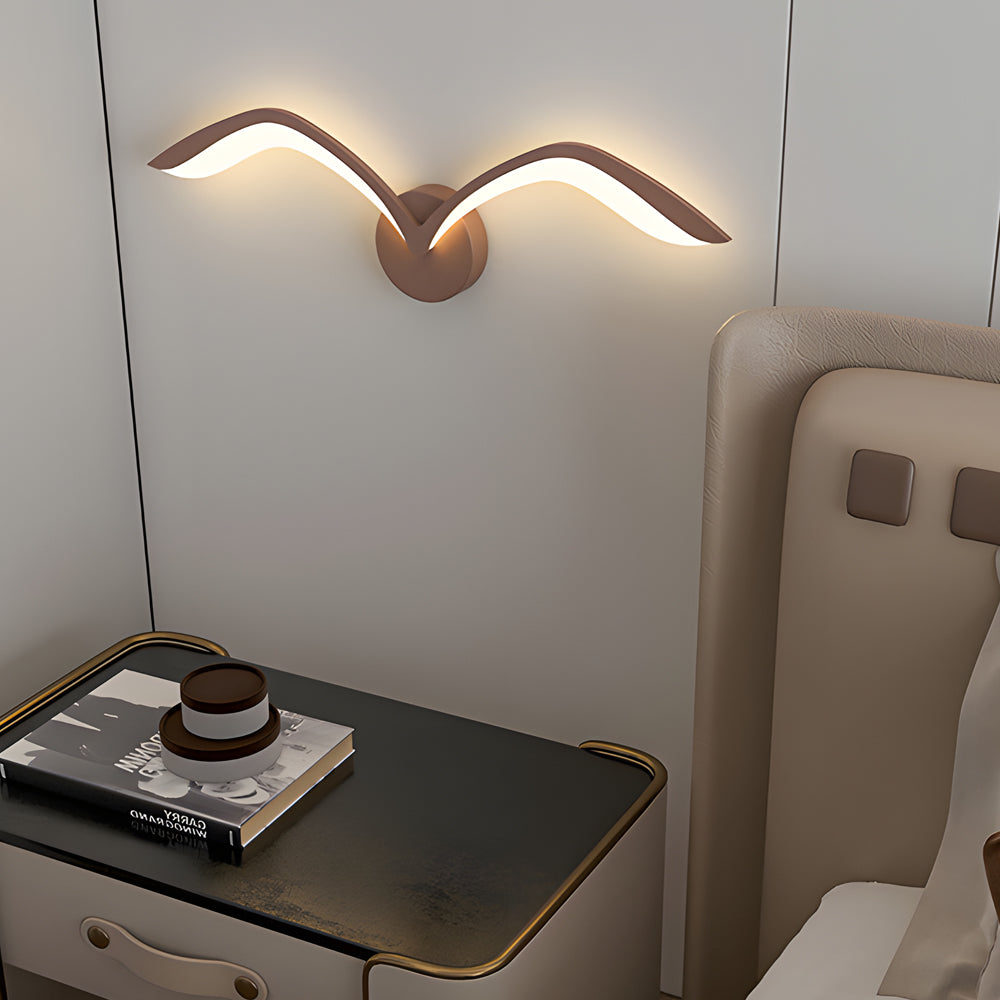 Seagull lighting sconces with a modern design, illuminating a stylish interior wall.