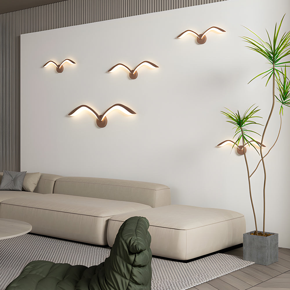 Seagull lighting sconces with a sleek design, providing ambient light in a bedroom.