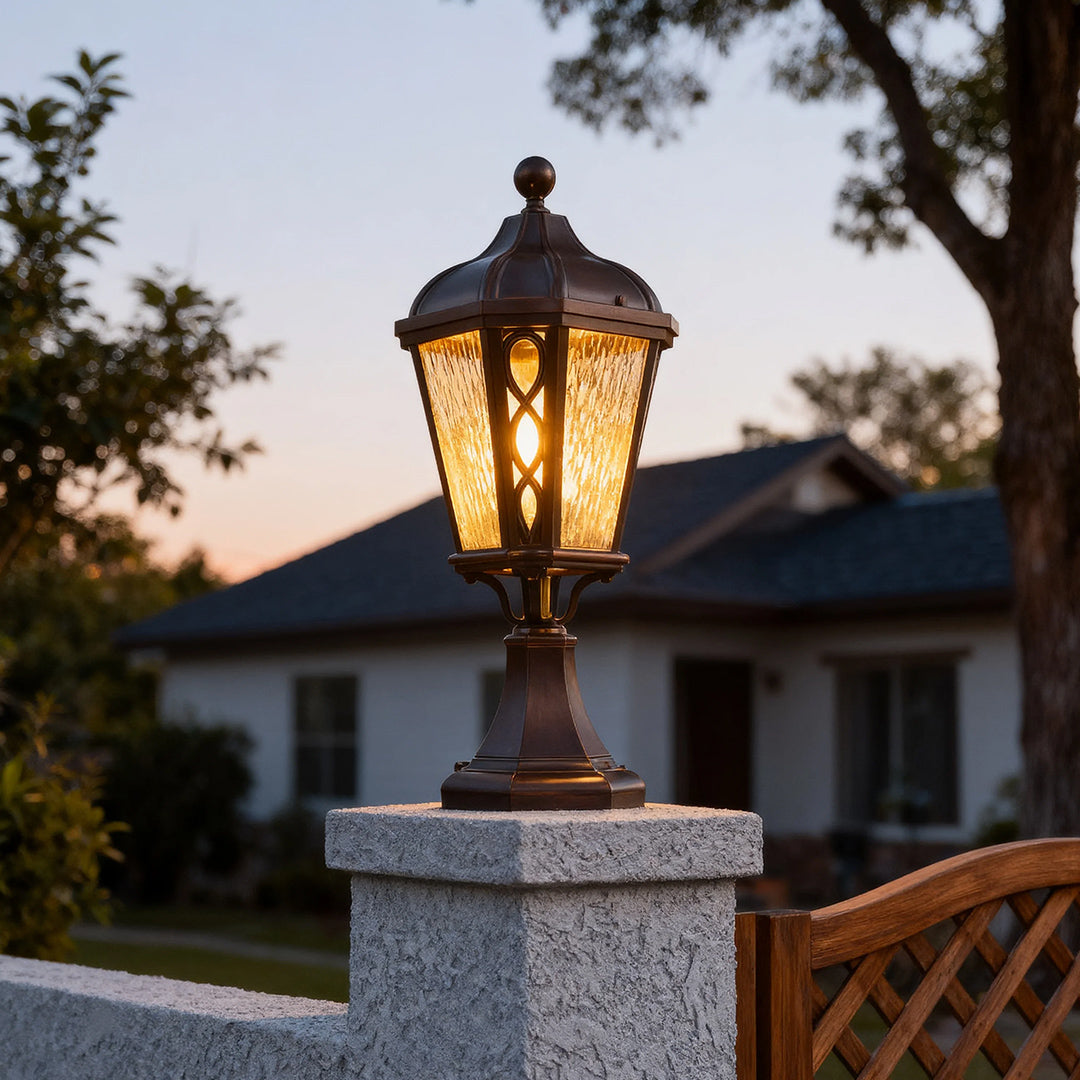 Black post light in a seaside garden, stylish and warm outdoor lighting solution