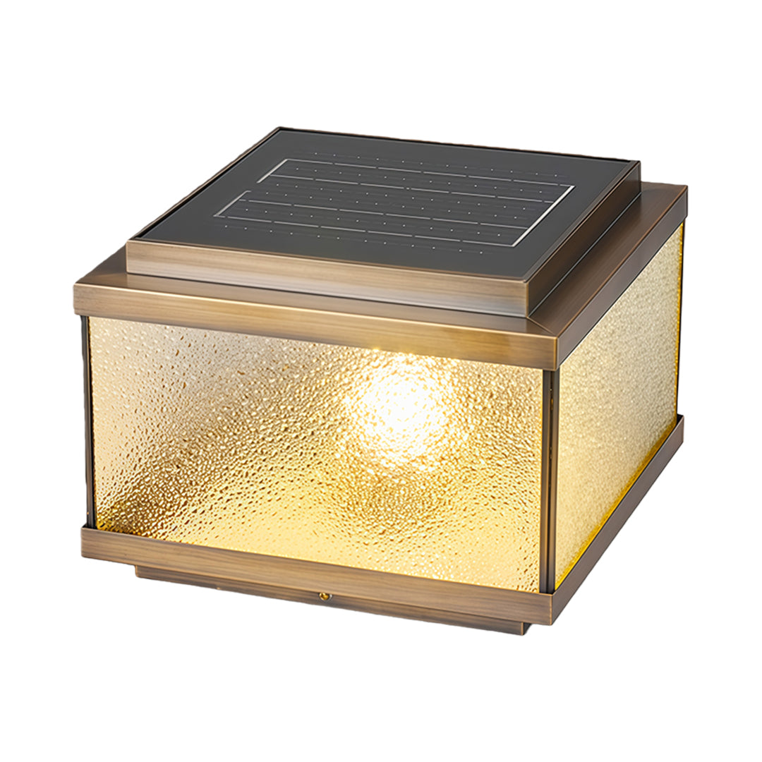 Modern garden pillar light featuring seeded glass design creating soft illumination for outdoor spaces