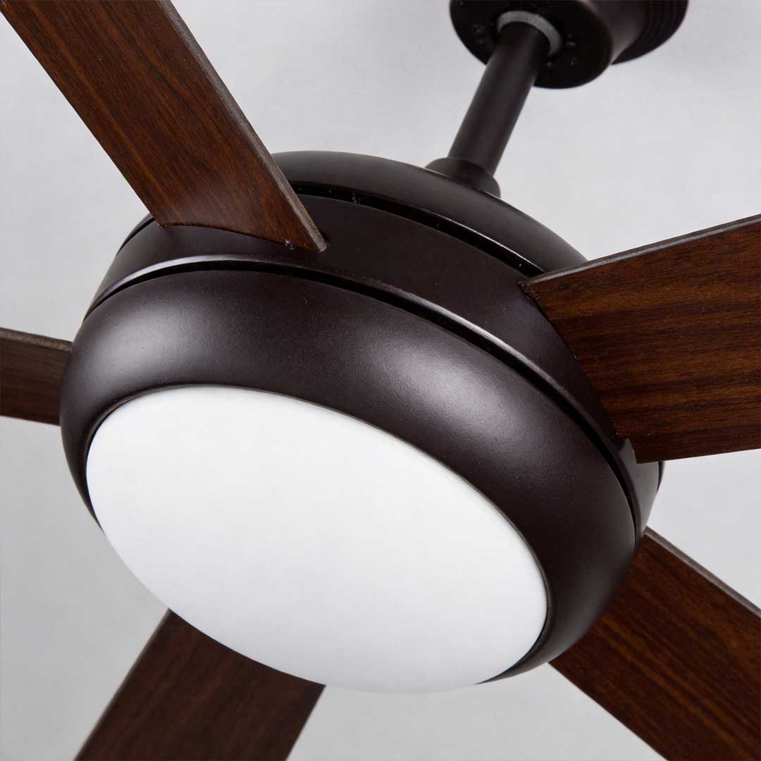 Semi-flush mount ceiling fan with light, side view of the motor and blades.