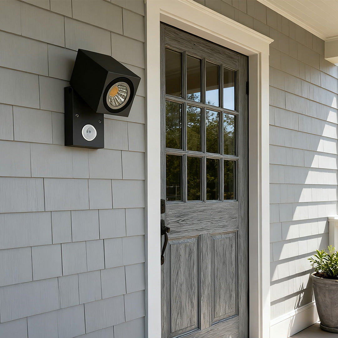 Sensor wall lights outdoor with motion sensor, installed near a front door.