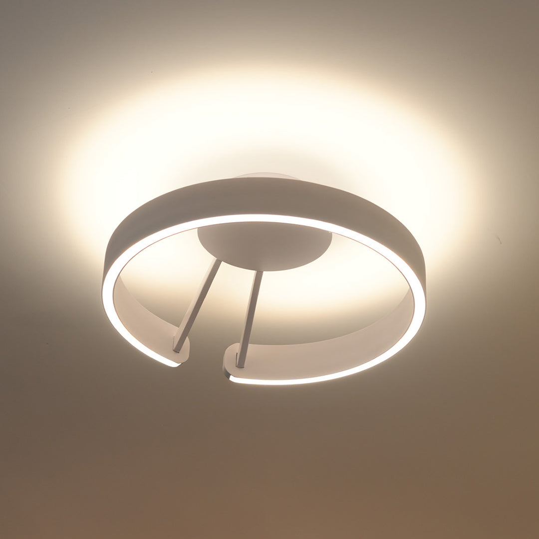 Serene halo flush mount ceiling light featuring glass shade chandelier aesthetic in white with segmented ring design and warm illumination.