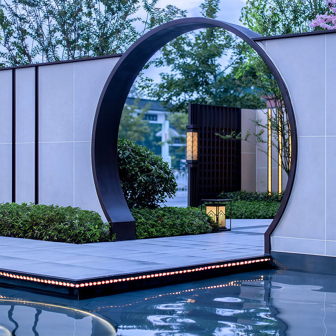 A series of lantern outdoor lights along a garden path, adding style and illumination to the landscape.