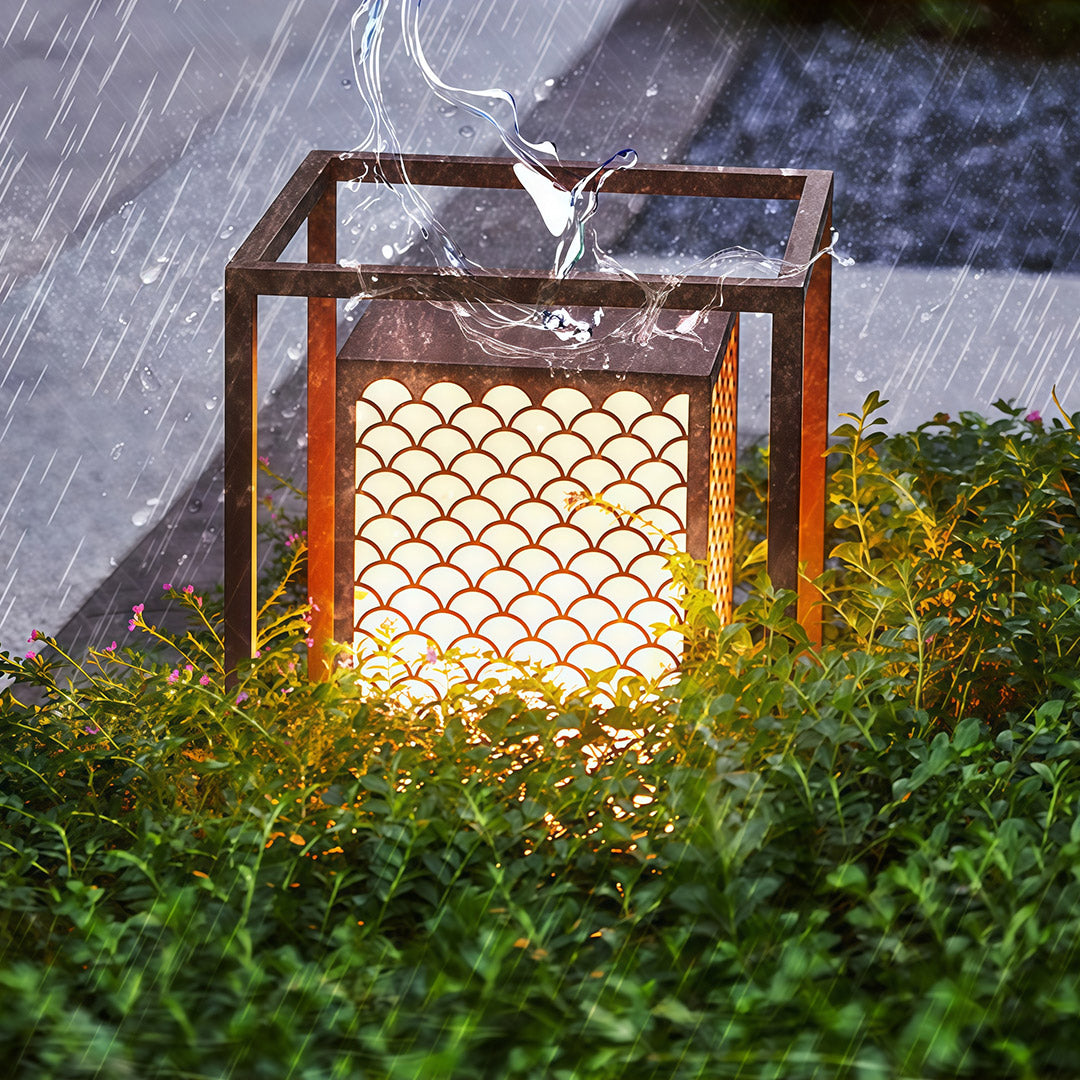 Set of bollard lights along a garden path, creating a modern and functional lighting solution for outdoor spaces.