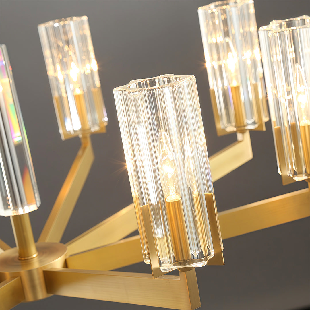 Modern luxury chandeliers detail highlighting brass frame and ribbed glass cylinder texture