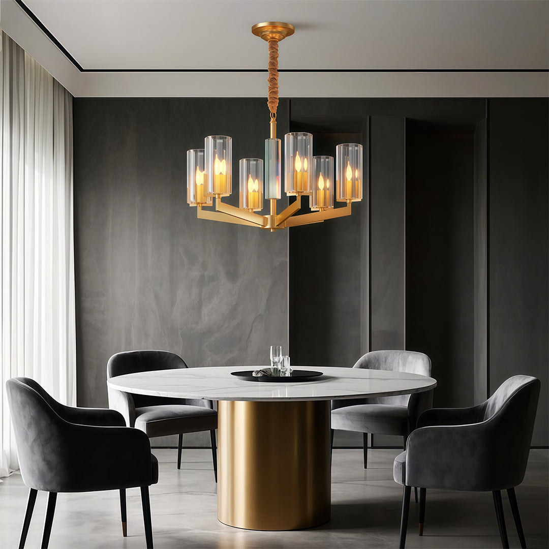 Shell chandeliers lighting elegant dining room with dark grey walls and round white marble table