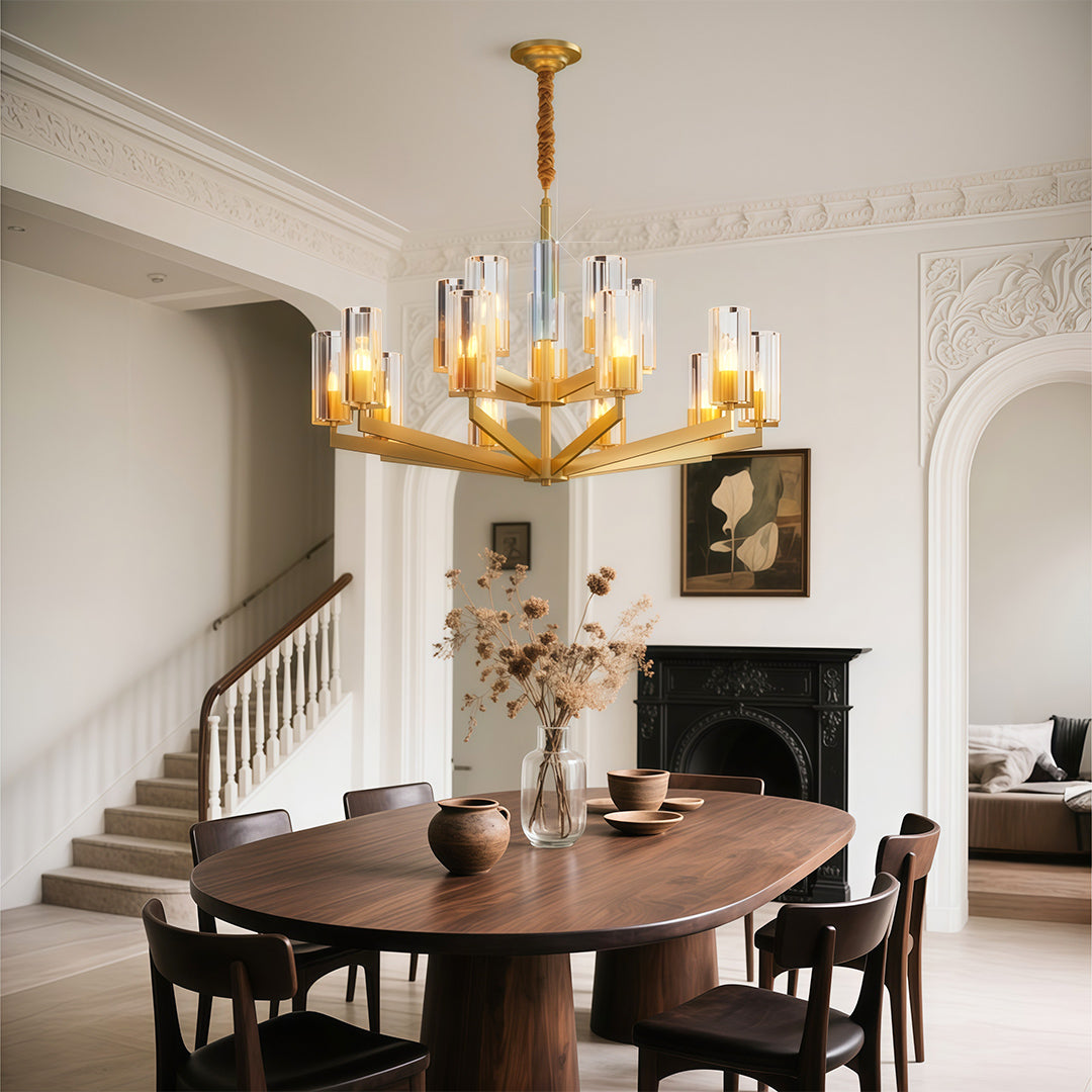 Modern luxury chandeliers lighting elegant traditional dining space with ornate fireplace mantel