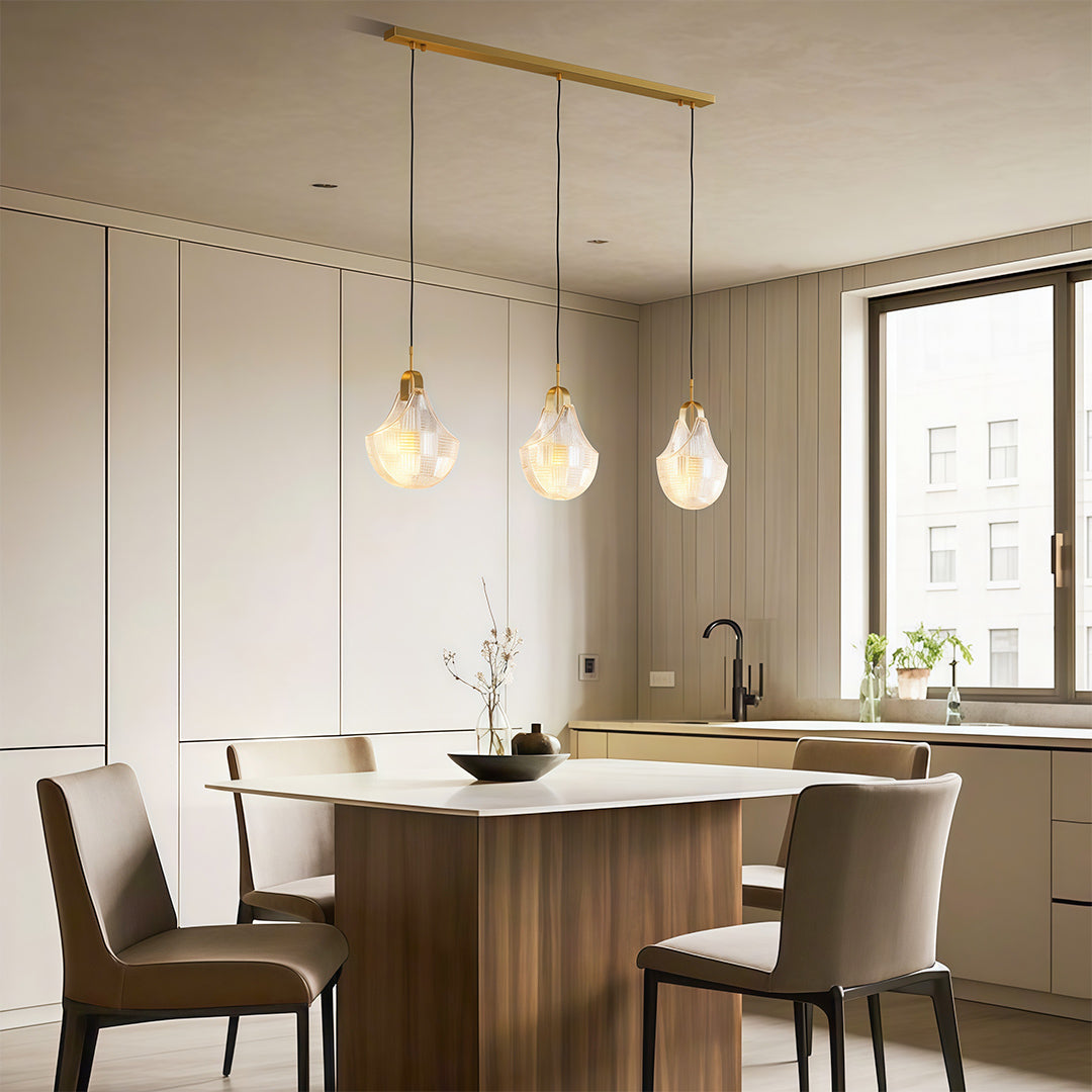 Shell chandelier light enhancing sophisticated dining room with round table and upholstered chairs.