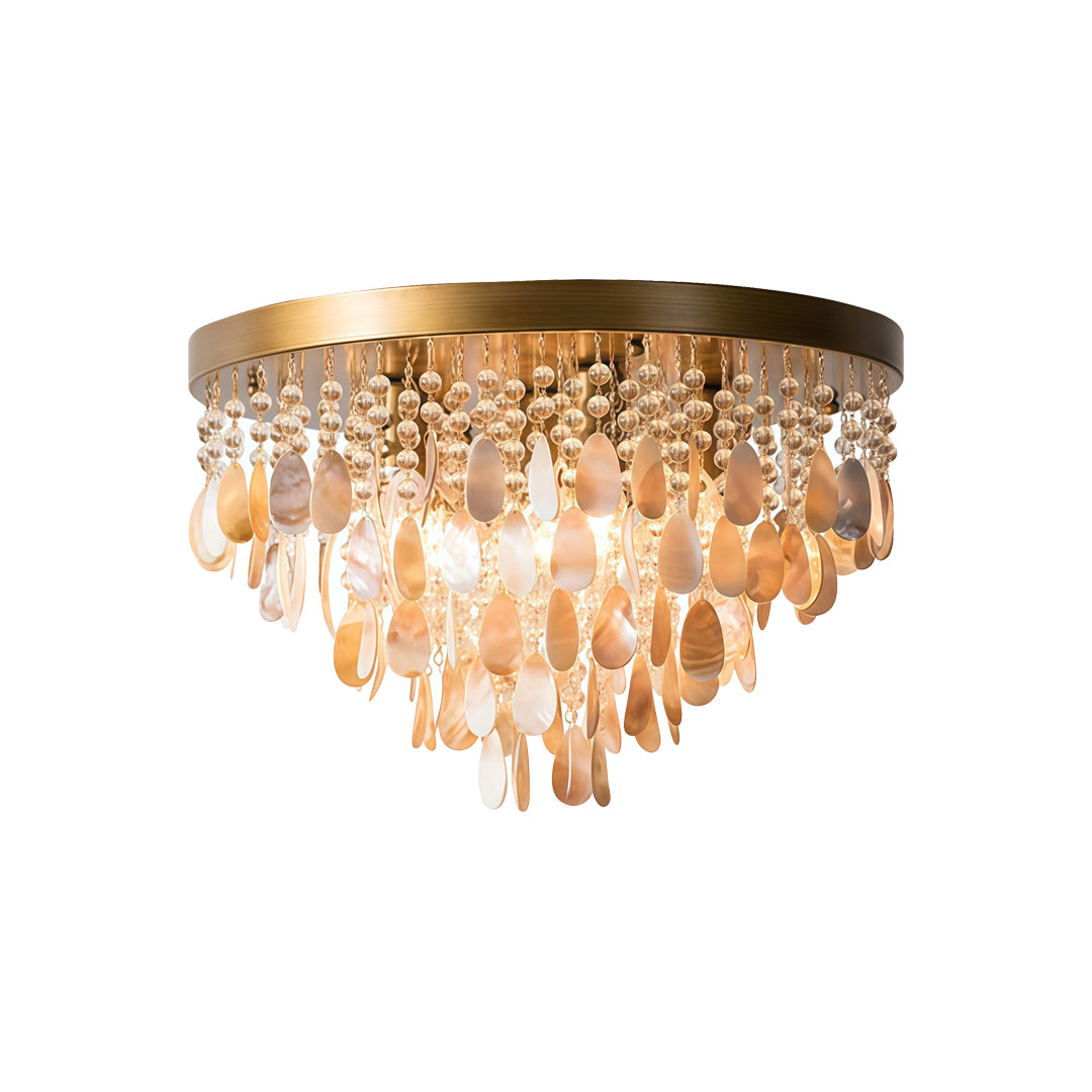 Shell flush mount light with cascading shell strands and warm ambient glow for luxury interiors.