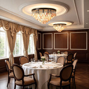 Shell flush mount light installed in an elegant dining room, featuring cascading shell accents and warm illumination.