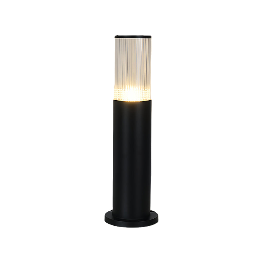 Short 15.7-inch model of the illuminated black bollard path light with a fluted glass diffuser, isolated on white.