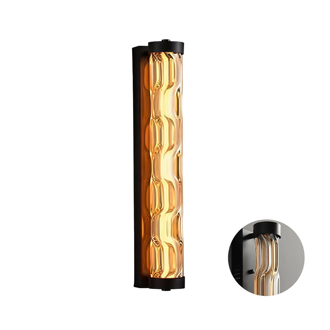 Short LED linear wall light with a black frame and amber textured glass diffuser.