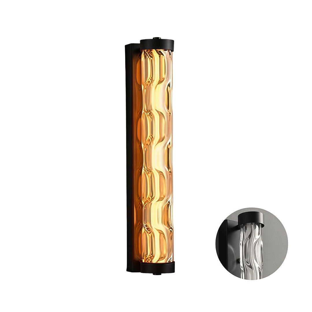 Short LED linear wall light with a black frame and clear textured glass diffuser.